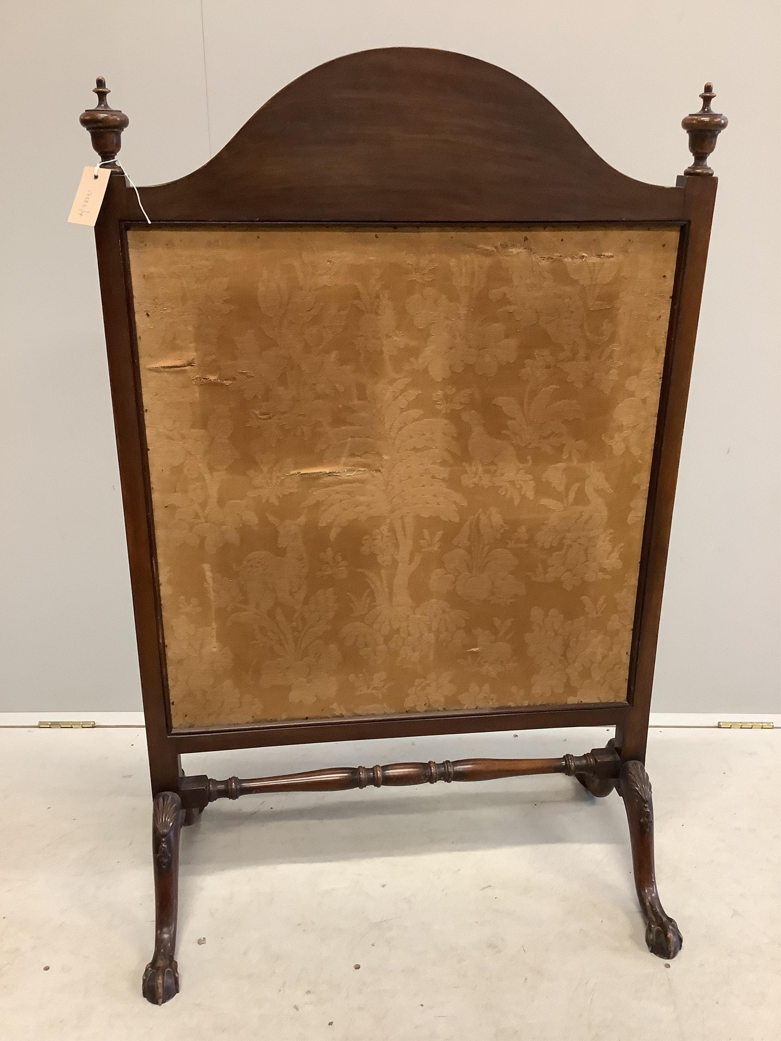 An early 20th century carved mahogany fire screen with tapestry panel, width 76cm, height 120cm. Condition fair to good.